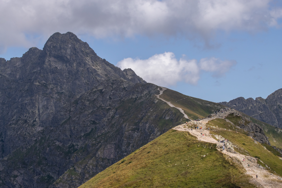 Scenic view of hikers on a trail in the Tatra Mountains, Zakopane.